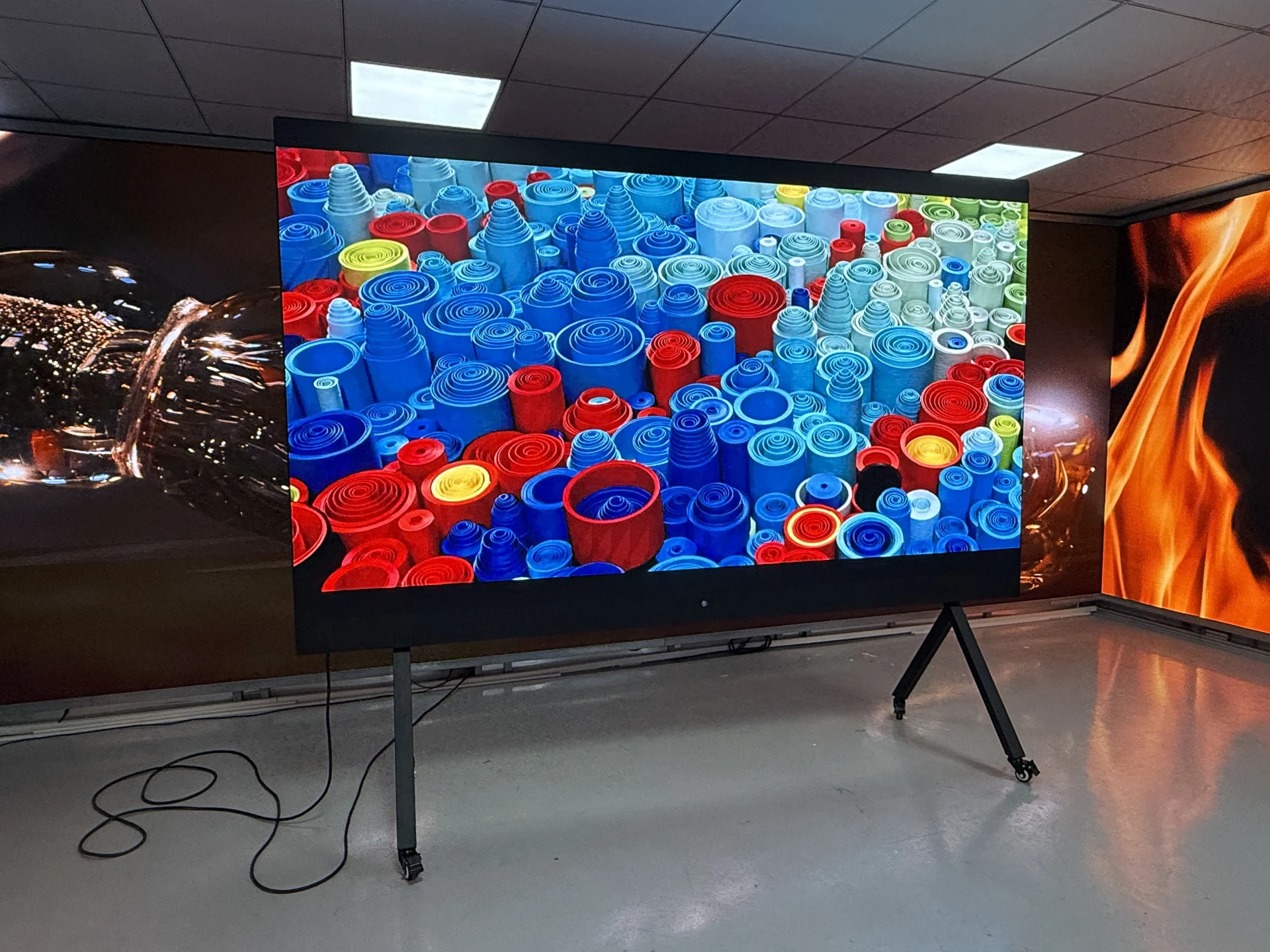 Actual all-in-one LED display on a mobile stand in a demonstration setting