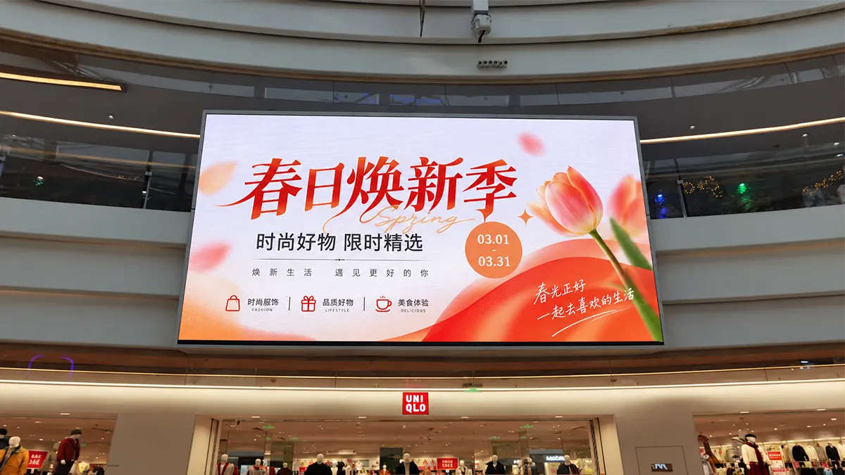Shopping mall atrium LED video wall with daytime foot traffic