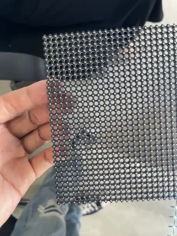 Flexible mesh panel in hand