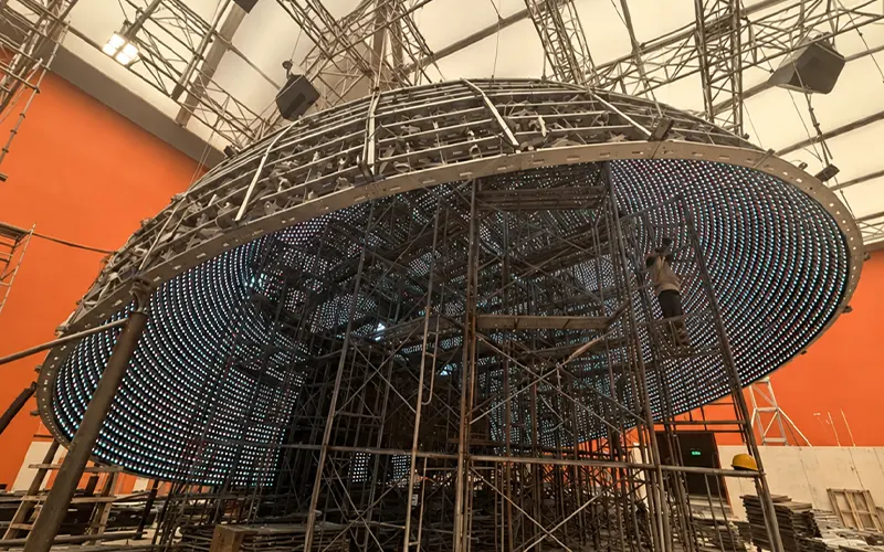 Hemisphere steel frame with LED modules being assembled