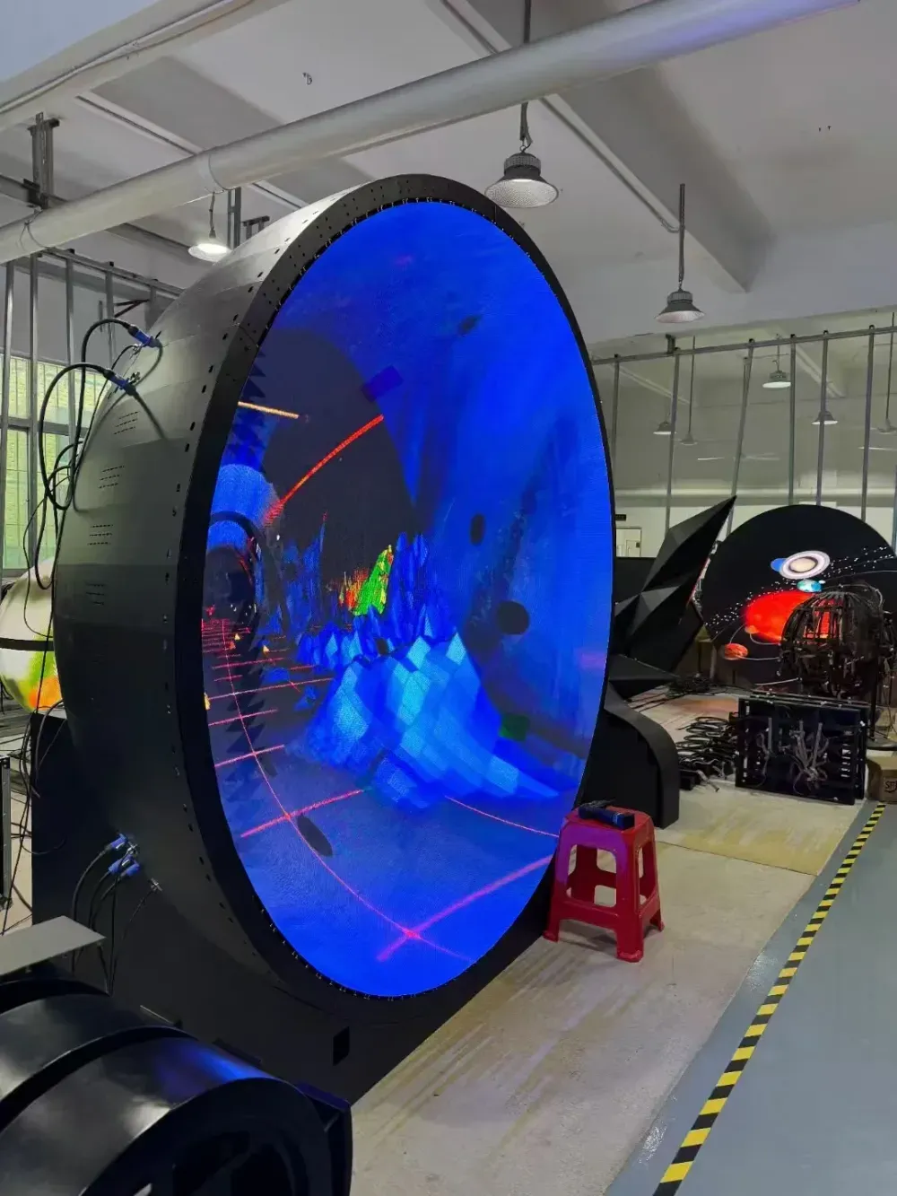 Inward-facing LED hemisphere displaying blue content during a workshop test